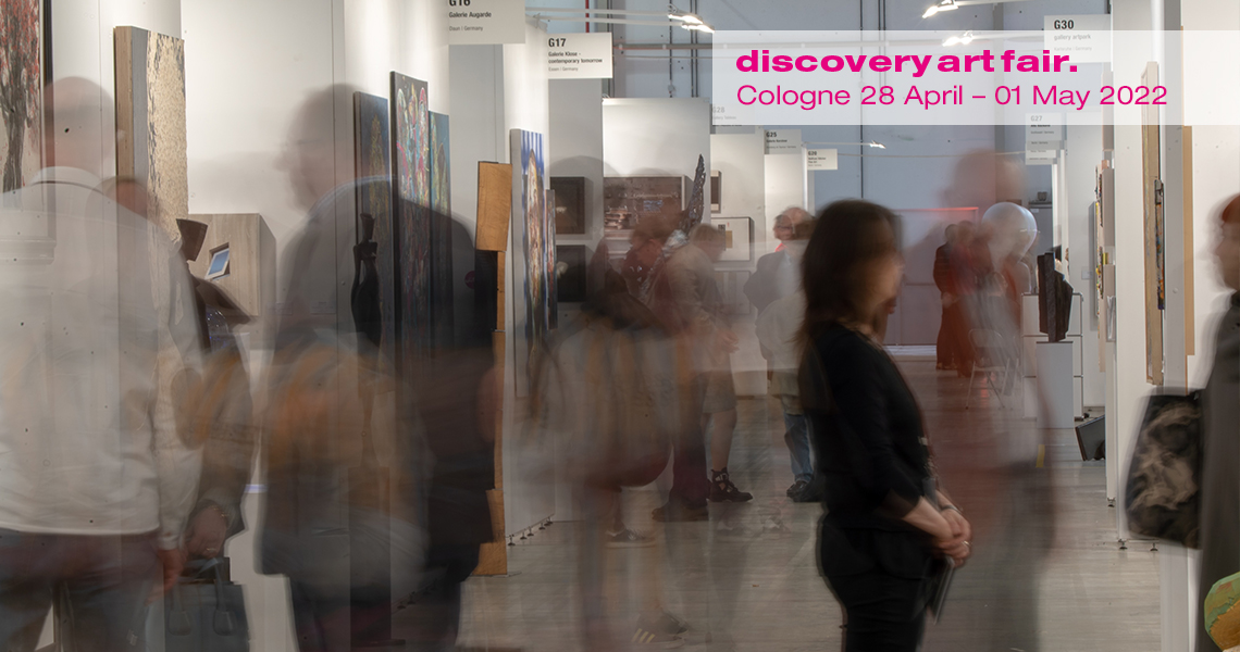 Visitors view contemporary art at Discovery Art Fair in Cologne